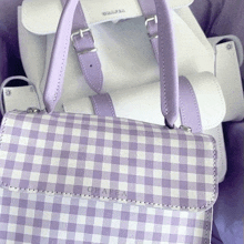 a purple and white gingham graffa purse