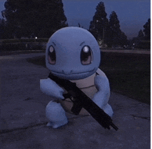 a squirtle is holding a gun on a sidewalk at night