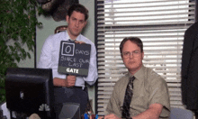 two men holding a sign that says 0 days since our last gate