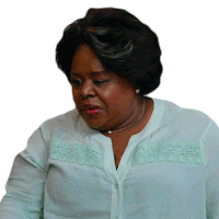 a woman wearing a light blue shirt with a lace border