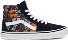 a pair of high top vans shoes with a floral print