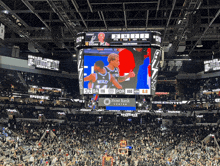 a basketball game is being played in a stadium sponsored by frost bank