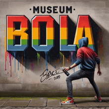 a man is spray painting the word bola on a brick wall