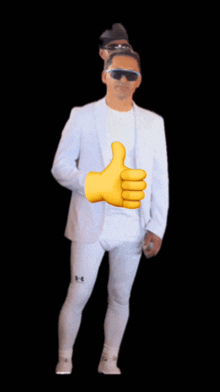 a man in a white suit giving a thumbs up sign