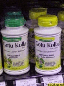 two bottles of gotu kolla are on a shelf in a store