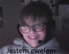 a boy wearing glasses and a headset with the words jestem cwelem written on the bottom