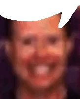 a blurry picture of a person 's face with a speech bubble above it