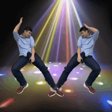 two men are dancing on a dance floor with lights shining on them