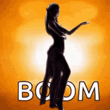 a silhouette of a woman dancing with the word boom in the background