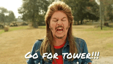 a man with a long haired mullet and a beard is screaming and saying go for tower