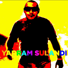 a man wearing sunglasses is standing in front of a yellow background that says warram suland