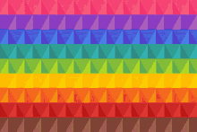 a rainbow colored geometric pattern with triangles in different colors