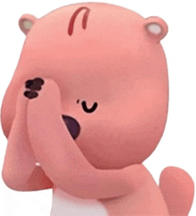 a pink teddy bear is covering his face with his hand .