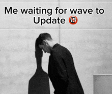 a black and white photo of a man with the words " me waiting for wave to update " above him