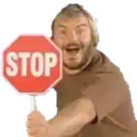 a man with a beard is holding a stop sign in his hand .