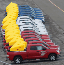 a row of tundra trucks are parked in a lot