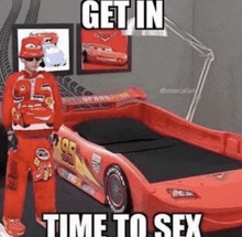 a man in a lightning mcqueen costume is standing next to a car bed