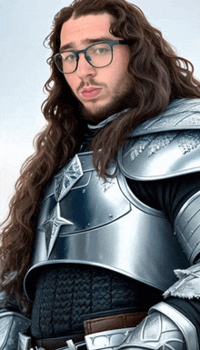 a man with long hair and glasses is wearing armour