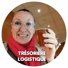 a woman wearing glasses and a red scarf is holding a cup with the words tresoriere logistice written on the bottom