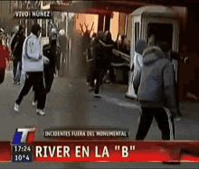 a group of people are standing in front of a sign that says river en la " b " on it