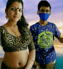 a woman and a boy wearing face masks are posing for a picture .