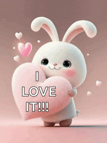 a bunny rabbit holding a pink heart that says i love it