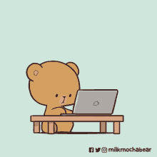 a teddy bear is sitting at a table using a laptop computer