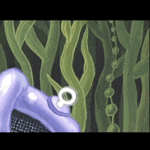 a purple object is surrounded by green plants