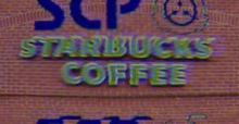 a starbucks coffee sign is on a brick building