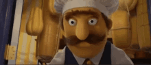 a cartoon character with a chef 's hat and a mustache