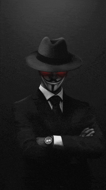 a man in a suit and tie with a anonymous mask on his face