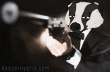 a badger in a tuxedo is pointing a gun and the website badger hybrid.com is visible