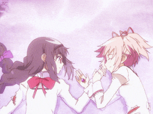 two anime girls are holding hands and one has a pink ring on her finger