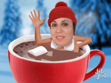 a woman 's face is in a cup of hot chocolate