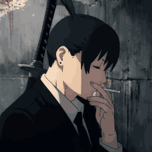 a man in a suit and tie smoking a cigarette