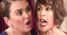 two women are making funny faces and one of them is holding another woman 's neck .