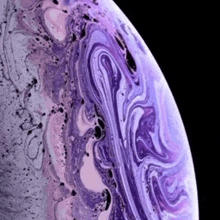 a close up of a purple and white marbled background on a black background .