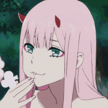 a girl with pink hair and red horns has her hand on her face