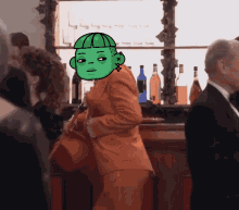 a woman in an orange suit has a green cartoon face on her head