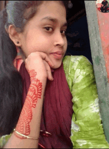 a girl with a henna tattoo on her wrist