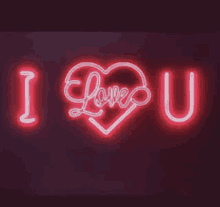 a neon sign that says `` i love you '' and has a heart in the middle .