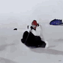 a person is riding a sled on a snowy surface .