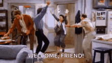 a group of people are jumping in the air in a living room with the words `` welcome , friend '' written on the bottom .