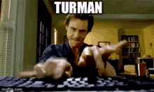 a man is typing on a keyboard with a caption that says turman