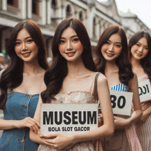 a group of women holding signs that say museum