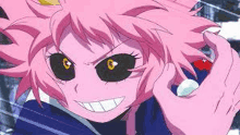 a close up of a pink anime girl with black eyes and a smile on her face .