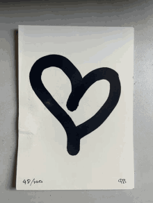 a drawing of a black heart with the number 49/100 on it