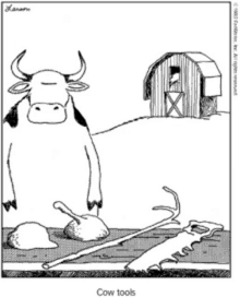 a cartoon of a cow standing next to a pile of cow tools