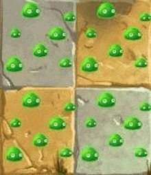 a bunch of green slimes are sitting on top of each other on a tiled floor .