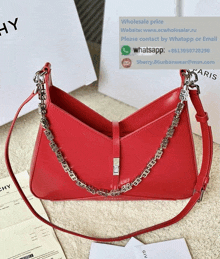 a red givenchy purse with a silver chain on it